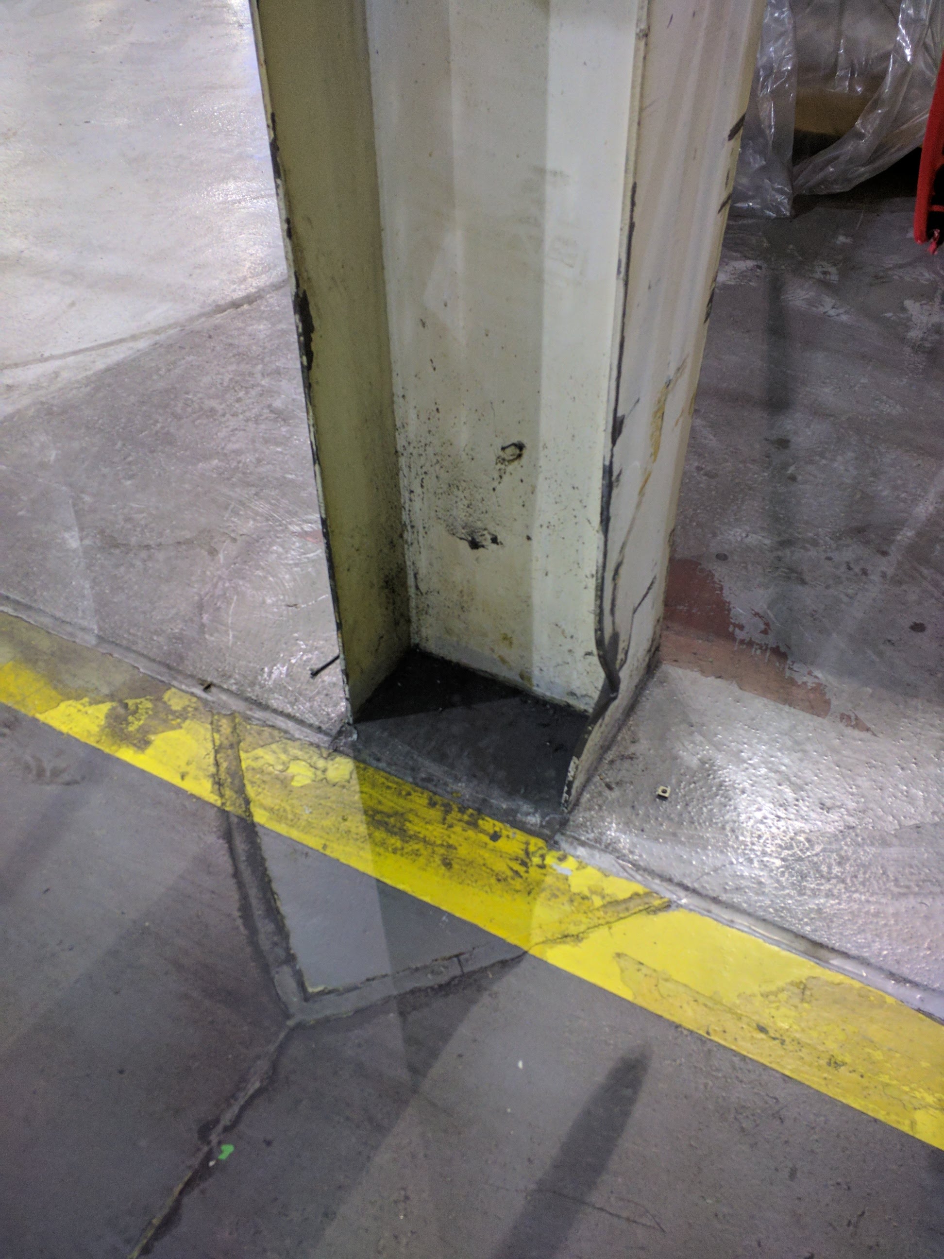 Damage to column adjacent to forklift aisle